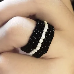 Черное кольцо из бисера с белым сердцем
